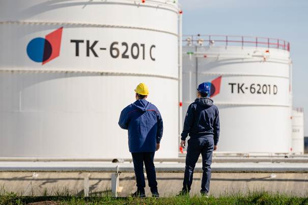 Two men in hard hats and helmets

Description automatically generated